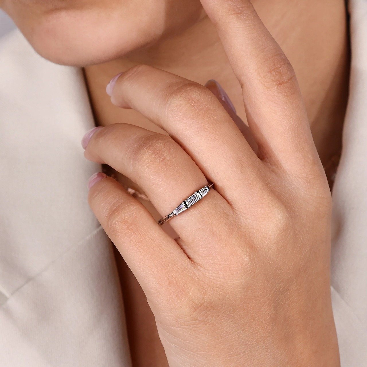 Bar set baguette ring worn on hand